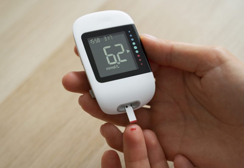 top-view-diabetic-woman-checking-her-glucose-level